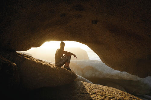 Girl resting in a cave